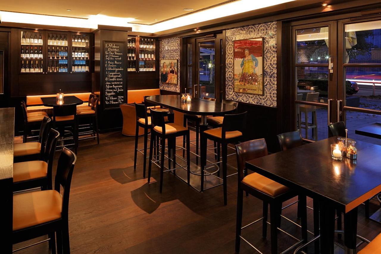 Grand Elysee Hamburg Hamburgo Exterior foto The interior of the restaurant